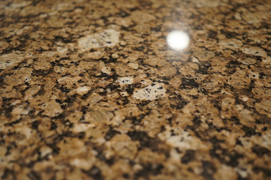 Granite countertop surface, close up.